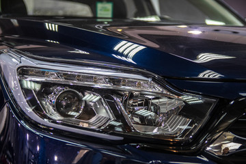Fototapeta premium Headlight of modern car with LED light