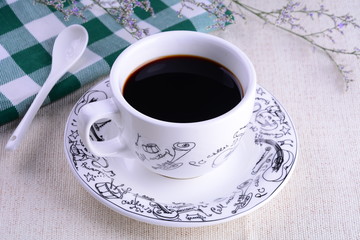 cup of coffee on wooden background