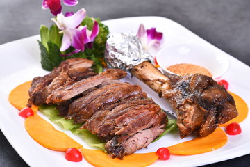 grilled steak with vegetables on white plate