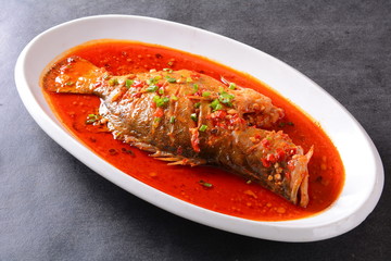 grilled salmon steak with sauce and vegetables