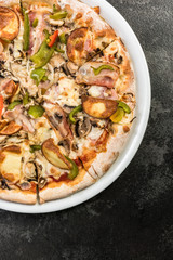 Bacon and green pepper traditional pizza