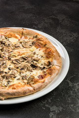 Freshly baked pizza on plate