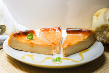 Bread Pudding: Knows in Brazil as 'Pudim de Pão'. Brazilian dessert made with milk, sugar and leftover bread. Dish decorated with honey and a mint leaf.
