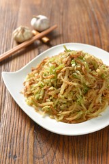 pasta with pesto sauce and basil