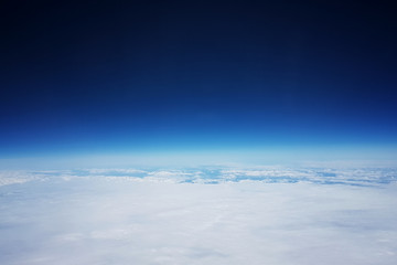 Low earth orbit - View of white clouds and mountains during the flight to the low orbit of the...
