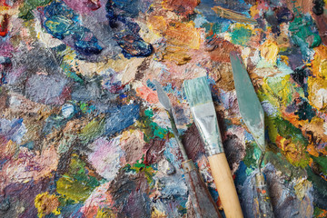 oil paints and paint brushes on a palette