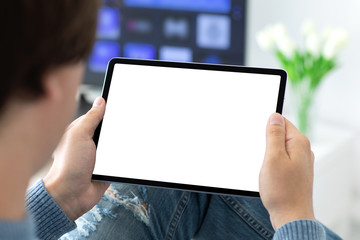 man holding in his hands computer tablet with isolated screen