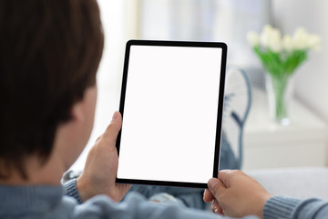 man holding in his hands computer tablet with isolated screen