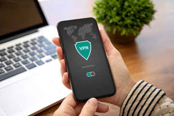 woman hands holding phone with app vpn private network