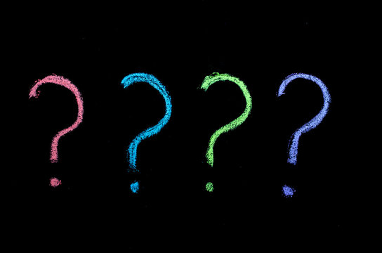 colored question marks on chalkboard
