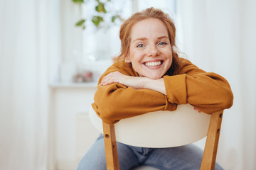 Happy casual friendly young redhead woman
