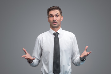 Shocked businessman gesturing with hands