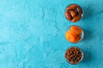 Flat lay composition with Ramadan Kareem food on color background