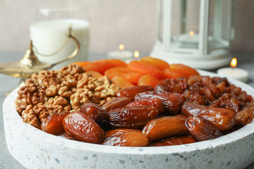 Decoration and food of Ramadan Kareem holiday against light background