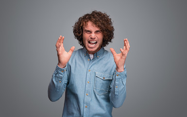Stressed guy gesturing with hands