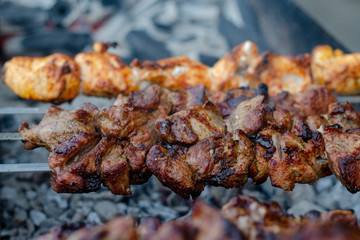 fried pieces of meat planted on skewers