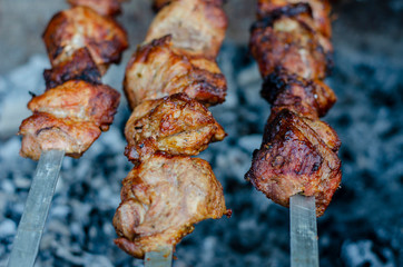 fried pieces of meat planted on skewers