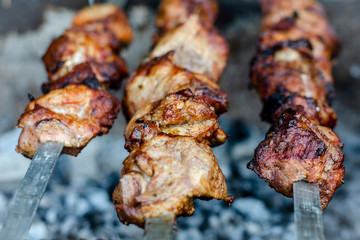 fried pieces of meat planted on skewers