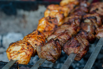 fried pieces of meat planted on skewers