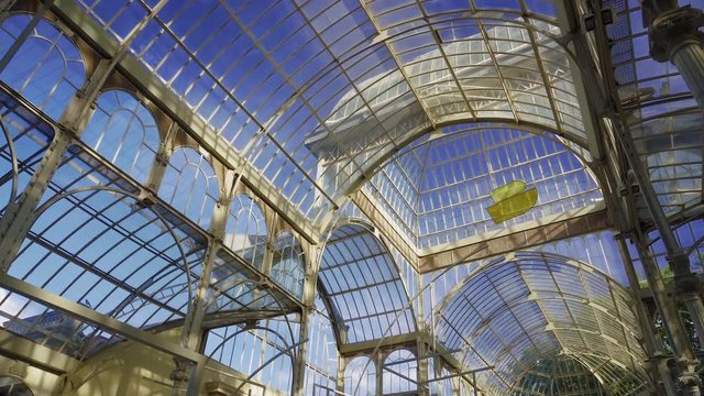 Madrid, Spain Parque de El Retiro Palacio de Cristal internal without crowd. 1887 glasshouse Crystal Palace, made of glass in an iron framework with free entrance at Buen Retiro Park.