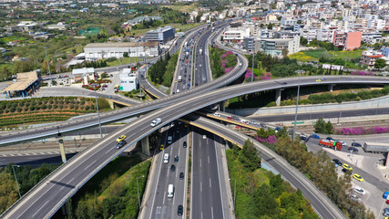 Fototapeta na wymiar Aerial drone view of popular highway multilevel junction road, passing through National motorway in traffic jam