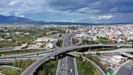 Obraz premium Aerial drone view of popular highway multilevel junction road, passing through National motorway in traffic jam