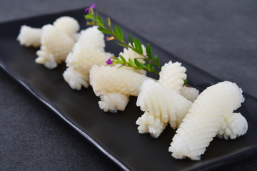 wedding rings on a bouquet of white flowers