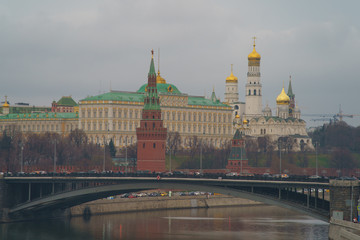 Image of historical Moscow Kremlin in the spring day. Kremlin Towers, Residence of the President of the Russian Federation,  Ivan the Great Bell Tower and Bolshoy Kamenny Bridge over Moskva River.