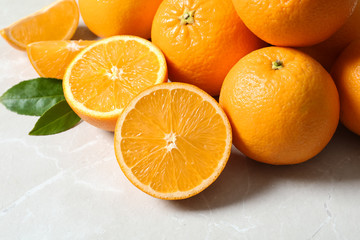 Pile of fresh ripe oranges on light background