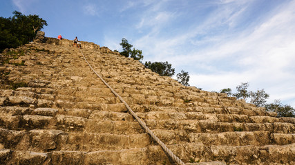 Ancient Coba Maya Ruin made out of stones in the thick jungle near Cancun, Yucatan, Mexico.
