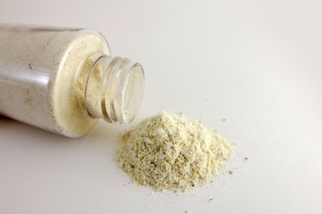 Amber powder in a clear bottle. Used for processing amber stones.