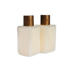 Mini bottles with cosmetic products on white background. Hotel amenities
