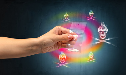 Female hand delivers illegal capsules with death s head wallpaper