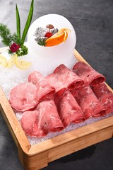 raw meat on wooden board