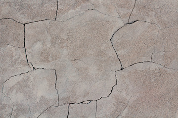 Obraz premium Cracked plaster on the wall. Close-up. Background. Texture.