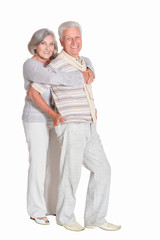 Senior couple hugging isolated on white background, full length