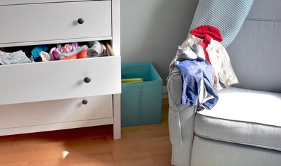 Baby clothes outfit chosen from dresser wardrobe
