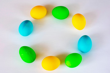 Easter eggs multicolored isolated on white background. Minimal easter concept. Happy easter card with copy space for text. Top view, flat.