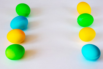 Easter eggs multicolored isolated on white background. Minimal easter concept. Happy easter card with copy space for text. Top view, flat.