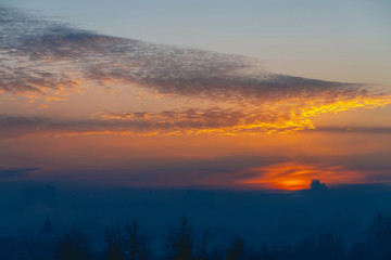 Sunny shine on clouds. Wonderful vivid dawn. Beautiful calm sunset. Scenic tranquil sunrise. Amazing peaceful cloudy sky. Sun above horizon. Picturesque sundown. Atmospheric cloudscape. Background.