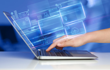 Hand using laptop with database reports and online work concept
