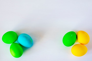 Easter eggs multicolored isolated on white background. Minimal easter concept. Happy easter card with copy space for text. Top view, flat.
