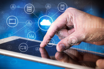 Businessman working on tablet with reports and graphs concept around
