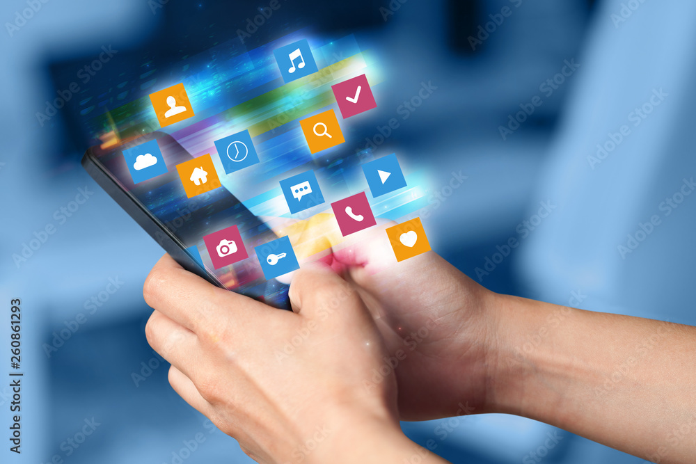 Poster Hand using phone with colorful fast moving application icons and symbols concept
