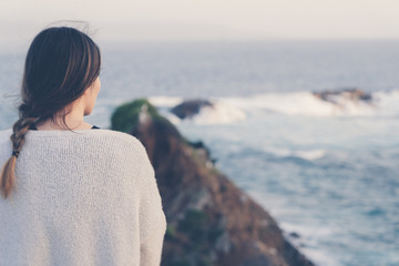 Fototapeta premium Woman Looking into ocean