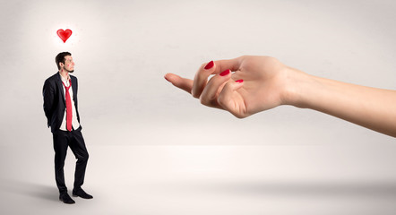 Foolish blind businessman in love going after big naked hand
