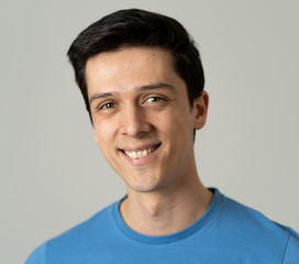 Fototapeta premium Portrait of young handsome man with happy and smiling face. Beauty concept and lifestyle