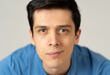 Fototapeta premium Portrait of young handsome man with happy and smiling face. Beauty concept and lifestyle