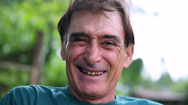Older man with a sneaky laugh. Crazy man laughing
