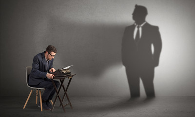 Shadow threatening hard worker man who is afraid
